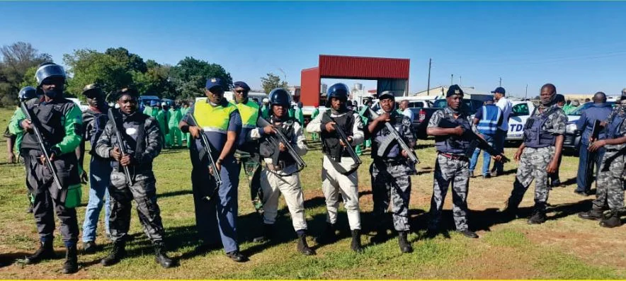 TDP armed security personnel assembled for an operational deployment