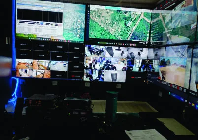 Security control-room operator coordinating operations