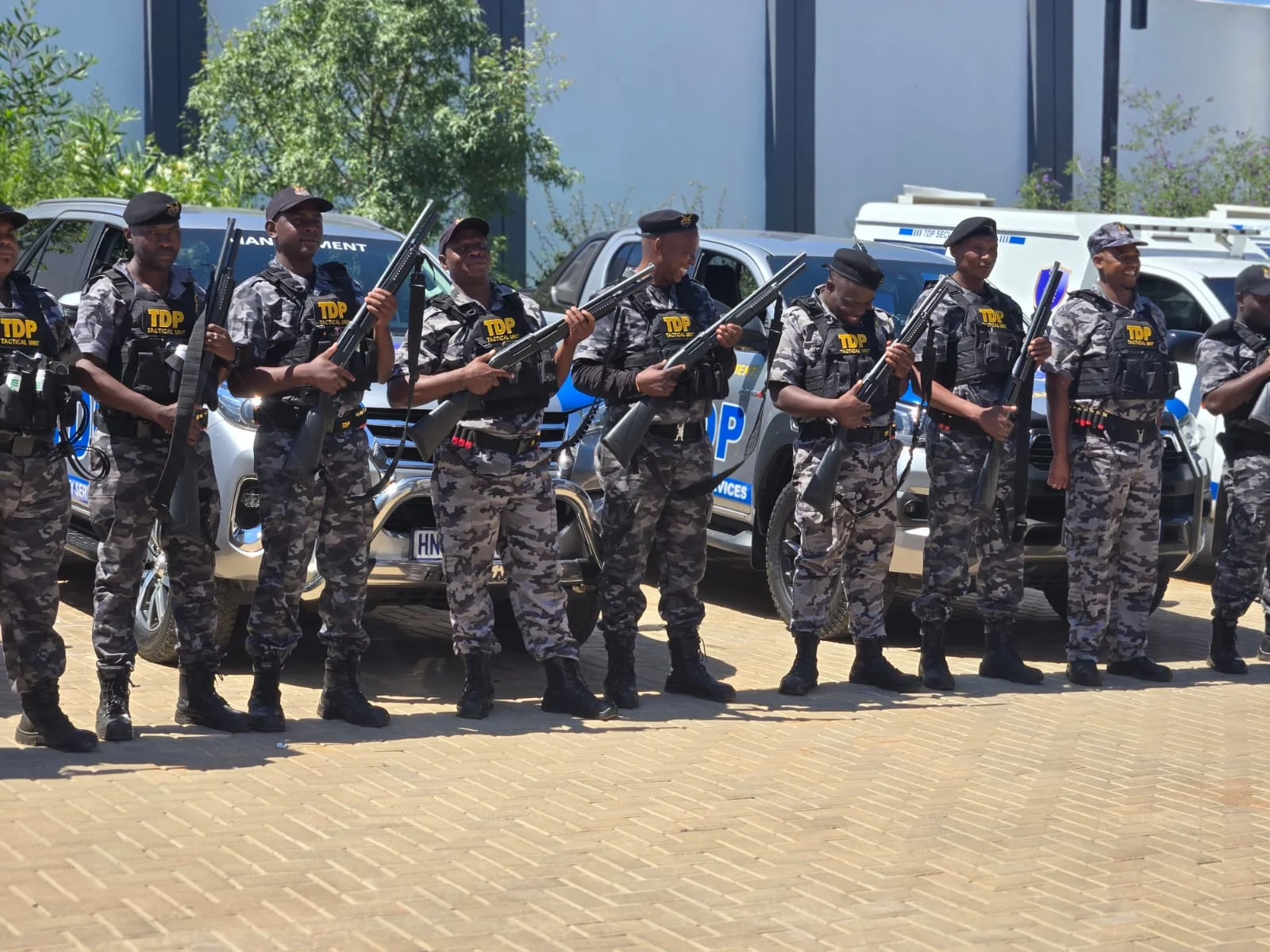 TDP tactical and armed-response officers with response vehicles